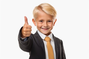 A young boy dressed in a suit, enthusiastically giving a thumbs up. This image can be used to depict positivity, success, approval, or encouragement.