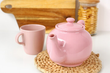 Composition with beautiful tea set and different items on white table
