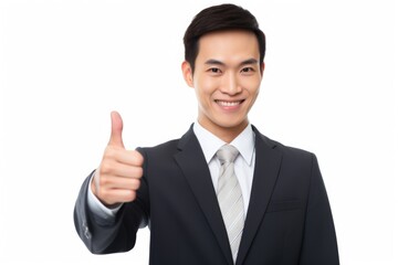 A man wearing a suit and giving a thumbs up gesture. Suitable for business, success, approval, and positivity concepts.