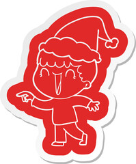laughing quirky cartoon  sticker of a man pointing wearing santa hat