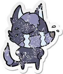 distressed sticker of a cartoon crying wolf