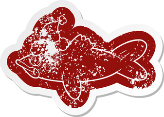quirky cartoon distressed sticker of a fish wearing santa hat