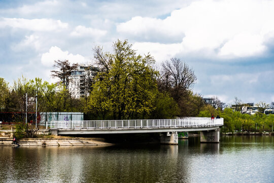 Pedestrian bridge in Bordei park over the lake. Bucharest, Romania.