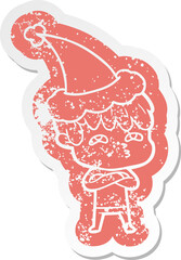 quirky cartoon distressed sticker of a curious man wearing santa hat