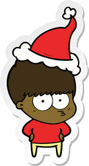 nervous hand drawn sticker cartoon of a boy wearing santa hat