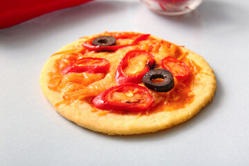 Tasty mini pizza on grey background