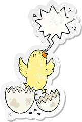 cartoon bird hatching from egg with speech bubble distressed distressed old sticker