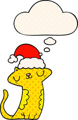 cute cartoon cat wearing christmas hat with thought bubble in comic book style