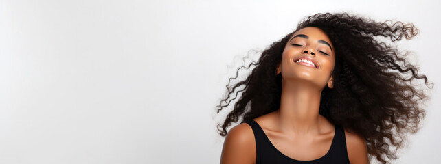 Natural Black Afro Beauty Empowerment: Captivating Studio Portrait with Copy-Space of a Radiant Smiling Model