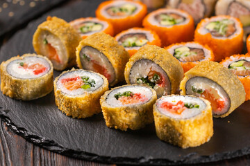 Japanese salmon sushi - Sushi menu norimaki and uramaki. Asian cuisine concept
