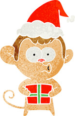 hand drawn retro cartoon of a christmas monkey wearing santa hat