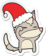 sticker of a tired wolf cartoon wearing xmas hat