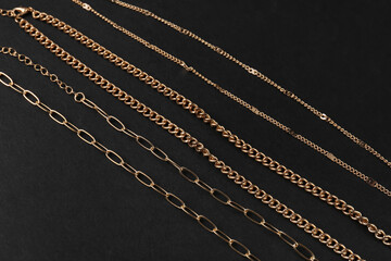 Beautiful chain necklaces on black background