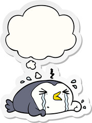 cartoon crying penguin with thought bubble as a printed sticker