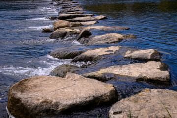 Abstract geometry and shapes of the stepping stone bridge and riverbank along Suncheon City riverwalk crossing the Dongcheon River in Jeollanam-do, South Korea