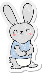 distressed sticker of a cute cartoon rabbit