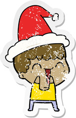 hand drawn distressed sticker cartoon of a happy man wearing santa hat
