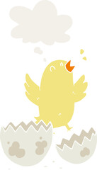 cartoon bird hatching from egg with thought bubble in retro style