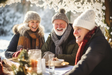 Happy family eating outdoors together in winter.