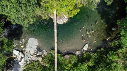 Fotobehang Melcocho river aerial landscape. famous river in Colombia for its crystal clear water. © camaralucida1