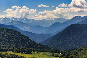 Large, high, green mountains, snow on the peaks, summer, Abkhazia.