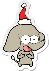 cute hand drawn sticker cartoon of a elephant wearing santa hat