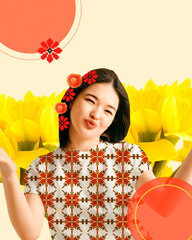 Pretty young chinse girl in blouse with ornament design standing over sunflowers background....