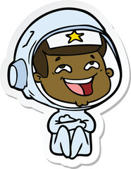 sticker of a cartoon laughing astronaut