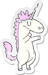 distressed sticker of a cartoon unicorn