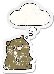 cartoon bear with thought bubble as a distressed worn sticker
