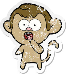 distressed sticker of a cartoon shocked monkey