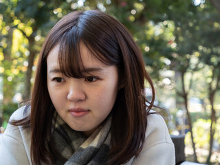 A Beautiful young Japanese woman looking cold in winter