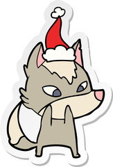 shy hand drawn sticker cartoon of a wolf wearing santa hat