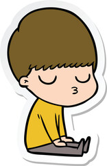 sticker of a cartoon calm boy