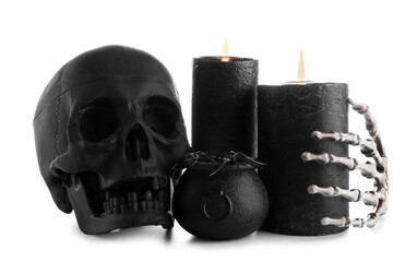 Wax candles and decor for Halloween on white background