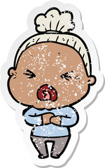 distressed sticker of a cartoon angry old woman