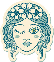 iconic distressed sticker tattoo style image of a maidens face winking