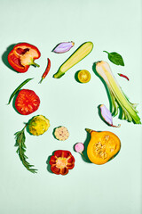 Top view of fresh, sliced vegetables on light background. Pumpkin, peppers, tomato, onion, zucchini. Concept of vegetables, garden, harvesting, organic food, farmer market and food. Copy space for ad