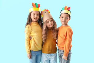 Cute little children on blue background. Thanksgiving Day celebration