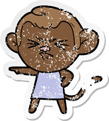 distressed sticker of a cartoon annoyed monkey
