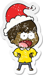 hand drawn distressed sticker cartoon of a shocked man wearing santa hat