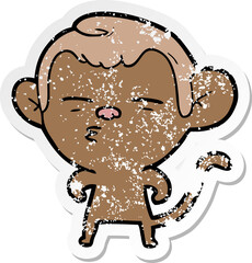 distressed sticker of a cartoon suspicious monkey