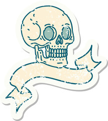 worn old sticker with banner of a skull
