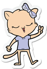 sticker of a cartoon cat with bow on head giving peace sign