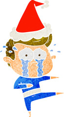 hand drawn retro cartoon of a crying dancer wearing santa hat