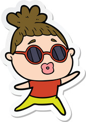 sticker of a cartoon dancing woman wearing sunglasses