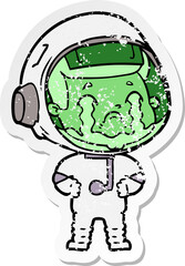 distressed sticker of a cartoon crying astronaut