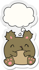 cartoon bear with thought bubble as a printed sticker