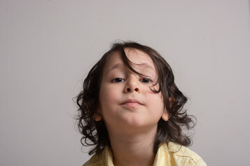 Portrait of a cute boy in sad mood
