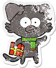 distressed sticker of a nervous dog cartoon with gift